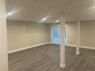 Applewood Estates Home finished basement with drop ceiling, recessed lighting, support column, and LVP flooring