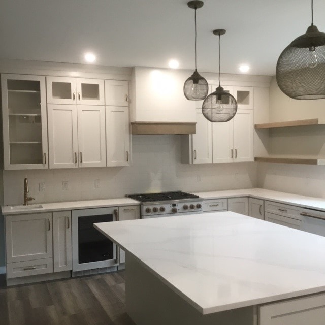 Custom New Build kitchen with gray lower cabinets, white uppers, quartz island, and bronze mesh pendant lights — Bedford, NH