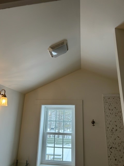 Partial Home Remodel bathroom with vaulted ceiling, exhaust fan, window, and floral wallpaper accent — Meredith, NH