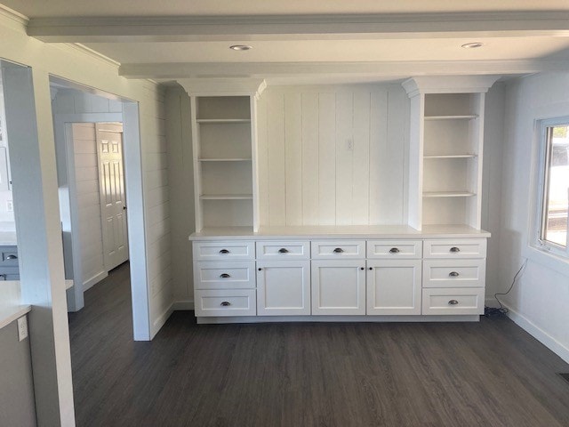 Lake Winnisquam Cottage Remodel living area with white built-in cabinetry, open shelving, and dark hardwood floors — Winnisquam, NH